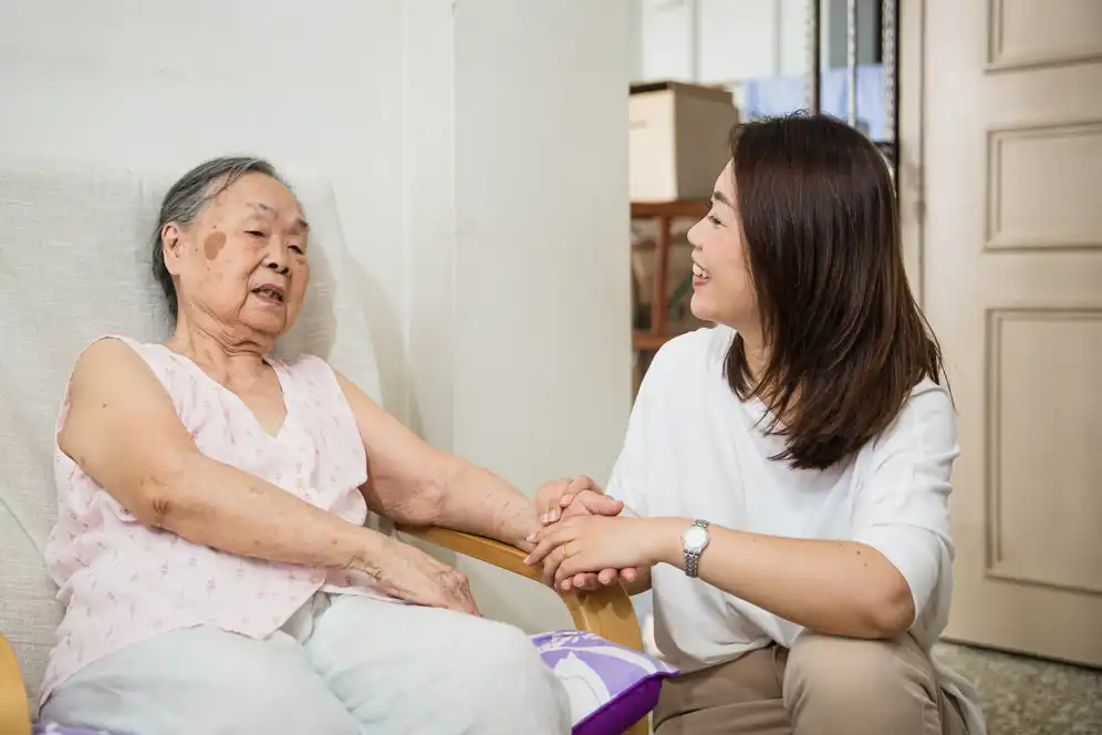 Woman comforting an elder