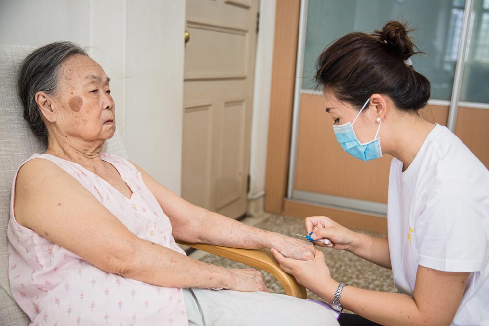 part-time-nurse Nurse administering medicine to the elderly